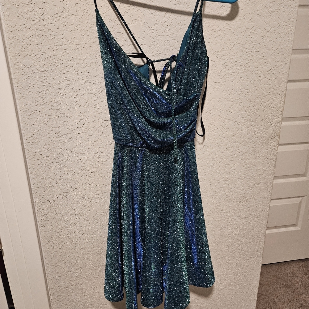 A short multi color dress with sparkled and a laced up back